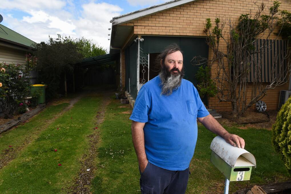 Left in limbo: Rodger Winch at his Wodonga property which VicTrack has put a land ownership claim on. The affected area includes his shed, driveway and porch corner of the house. Picture: MARK JESSER 