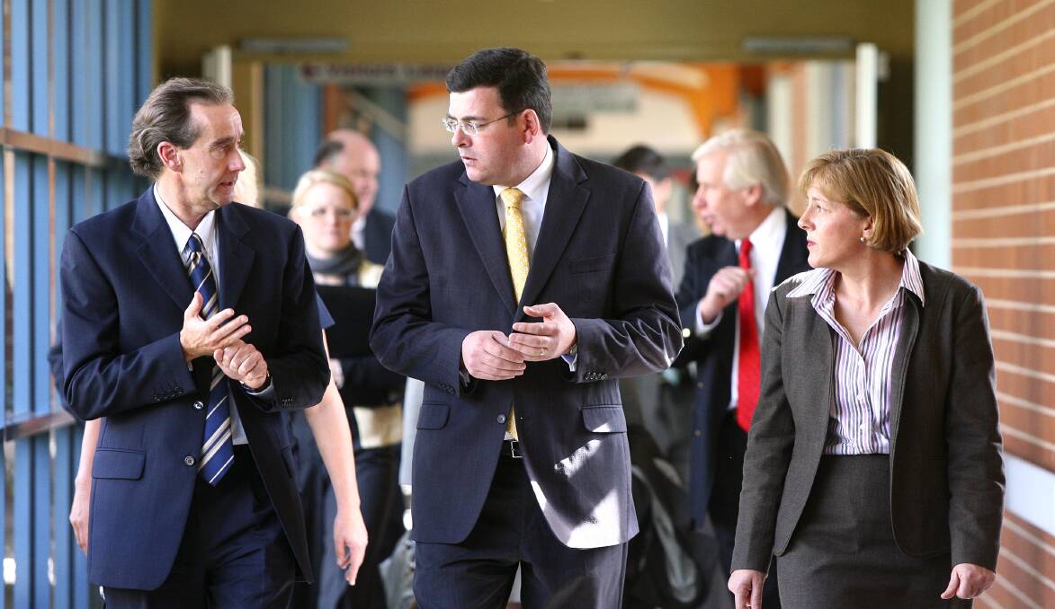 Flashback: Daniel Andrews (centre) walks through a corridor at Albury hospital in 2009 amid a discussion about health services.