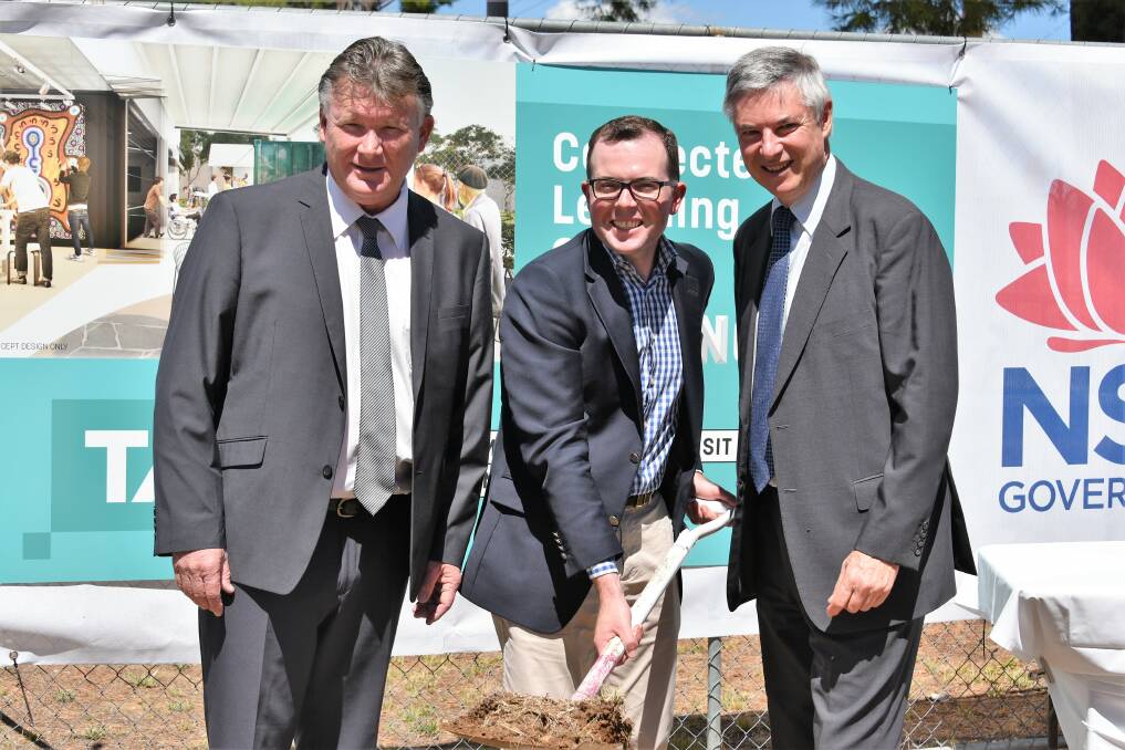 Milestone: NSW Tourism Minister Adam Marshall flips a sod to mark construction starting on the Corowa TAFE learning centre. He is pictured with Federation Council mayor Pat Bourke and Albury MLA Greg Aplin.