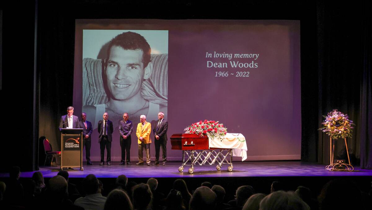 History makers: Mayor Dean Rees introduces Dean Woods' Olympic team-mates and cycling squad manager Ray Godkin at Tuesday's funeral. Picture: JAMES WILTSHIRE