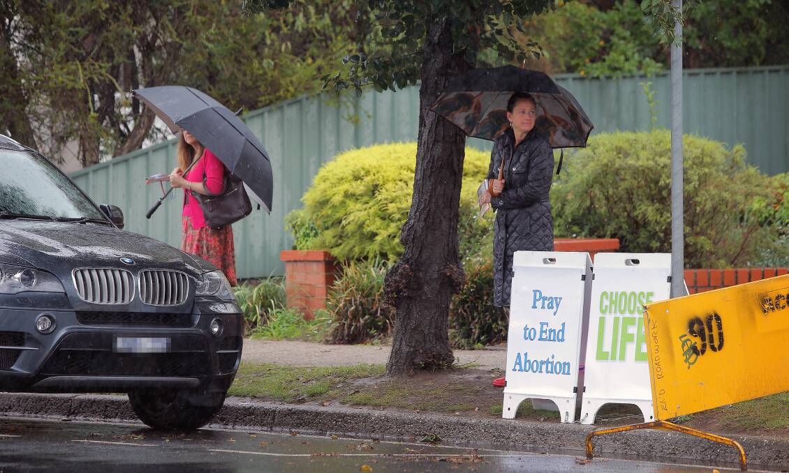 Flashback: Protesters outside the Englehardt Street clinic on a rainy day in 2014.