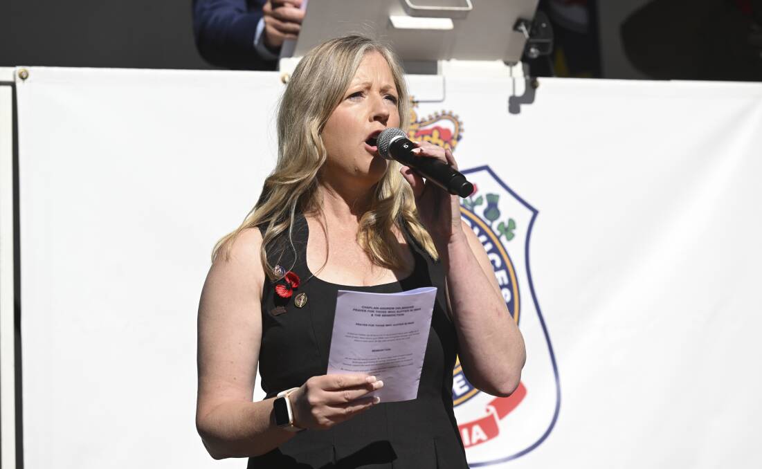 Singer Lisa Cullen gives her rendition of Advance Australia Fair at the morning service in Wodonga after having missed doing the same song at the dawn service. Picture by Mark Jesser