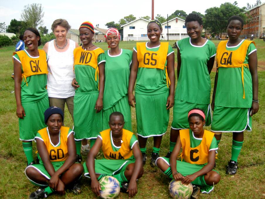 Flashback: Marg Docking pictured with a netball team in Uganda. She travelled three times a year for up to five weeks to help establish and maintain her charity in the east African nation.