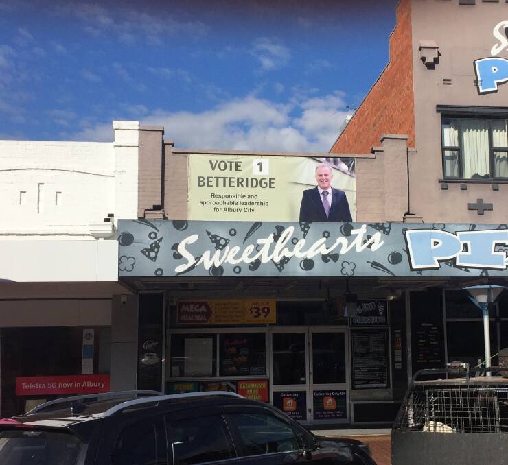 Shouting from the rooftop: Poster for Albury Council election candidate Daryl Betteridge which has adorned his former pizza shop for most of this year.