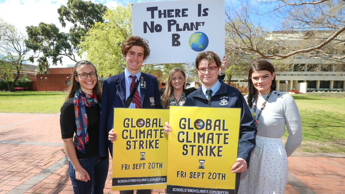 Flashback: Amanda Cohn (left) and Eli Davern (second from right) promote a school students' strike for climate in 2019. They will now represent the Greens in next month's federal election.