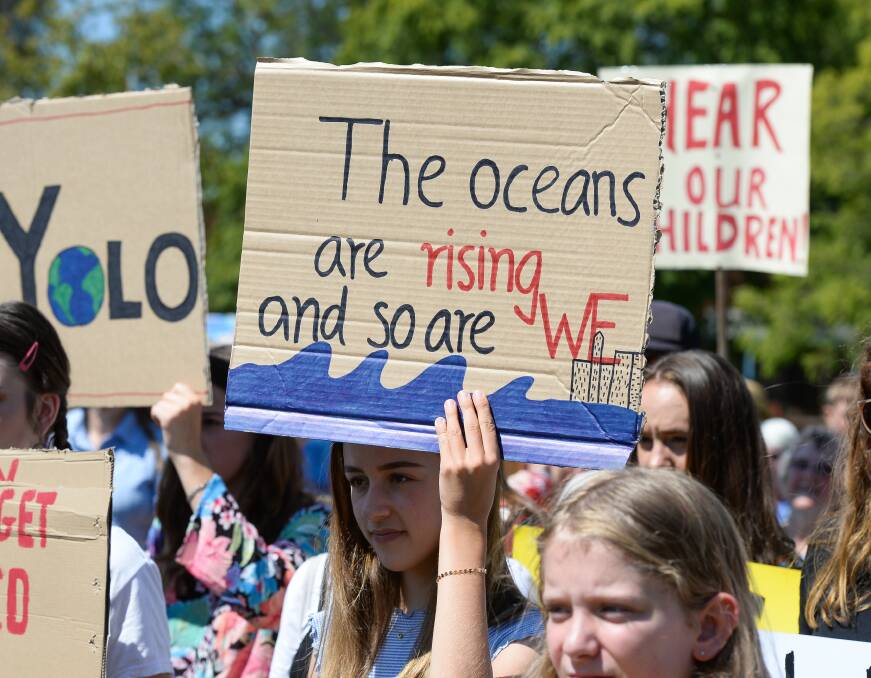 Sign of concern: There were plenty of handwritten placards reflecting the concerns of young people from across the North East and Border on display in Albury's QEII Square on Friday afternoon. Picture: MARK JESSER
