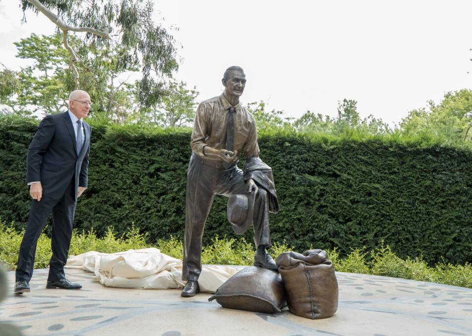 Voila: Governor-General David Hurley with the statue of former prime minister John McEwen which he unveiled in Canberra on Friday morning. Picture: CANBERRA TIMES