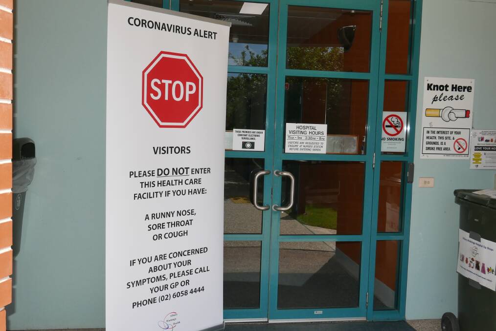 Clear message: A sign at the entrance to the Albury hospital makes it obvious that visitors should not enter if they have any cold or flu symptoms.