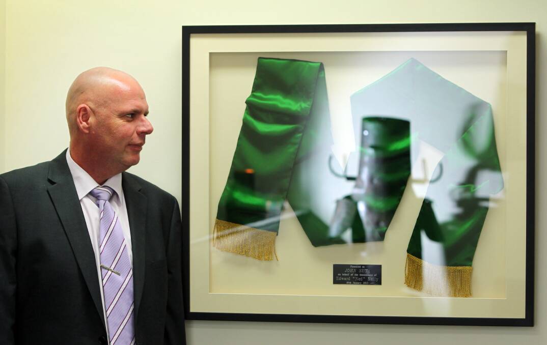 Kellyphile: Wangaratta lawyer John Suta's interest in bushranger Ned Kelly extends to owning a replica of the green sash awarded to the outlaw when he rescued a boy from drowning.