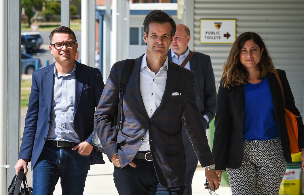 New player: Lino Saputo (centre) with his company's chief operating officer Kai Bockmann and communications chief Sandy Vassiadis arriving at Coulston Park, Tangambalanga on Tuesday morning. Picture: MARK JESSER
