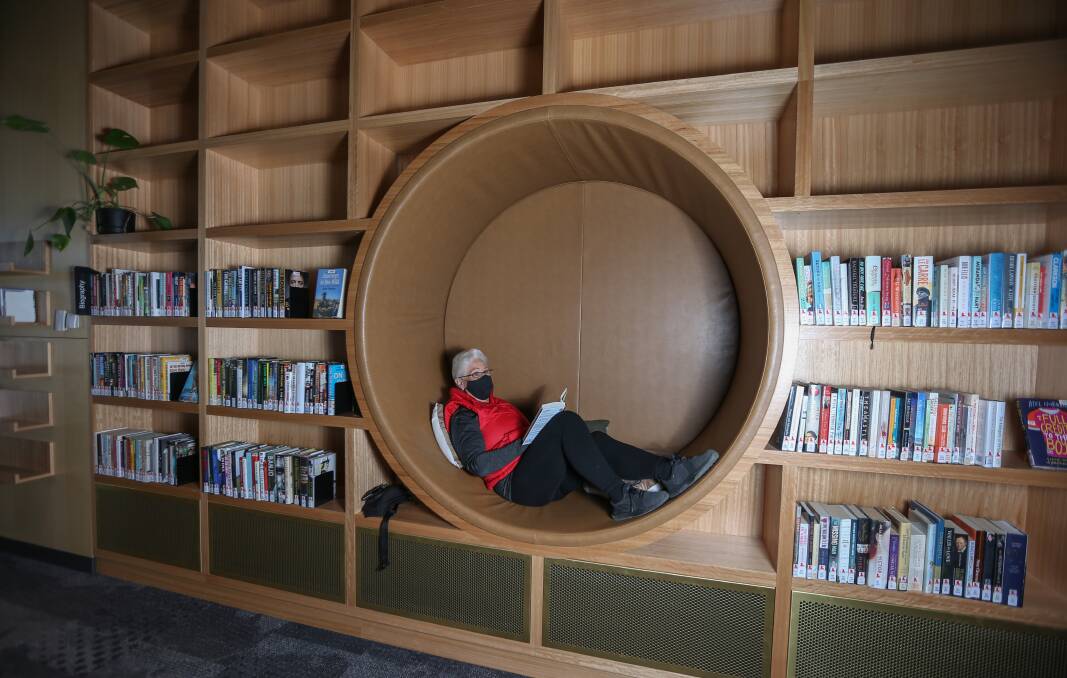 Rounded view: Cris Hockey samples a circular spot created for readers at Wodonga's new library. Picture: TARA TREWHELLA