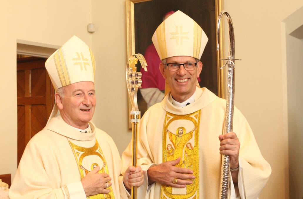 Flashback: The new Bishop of Wagga Mark Edwards (right) at the time he was installed as an auxiliary bishop of Melbourne alongside Terence Curtin in 2014. Picture: CATHOLIC MEDIA 