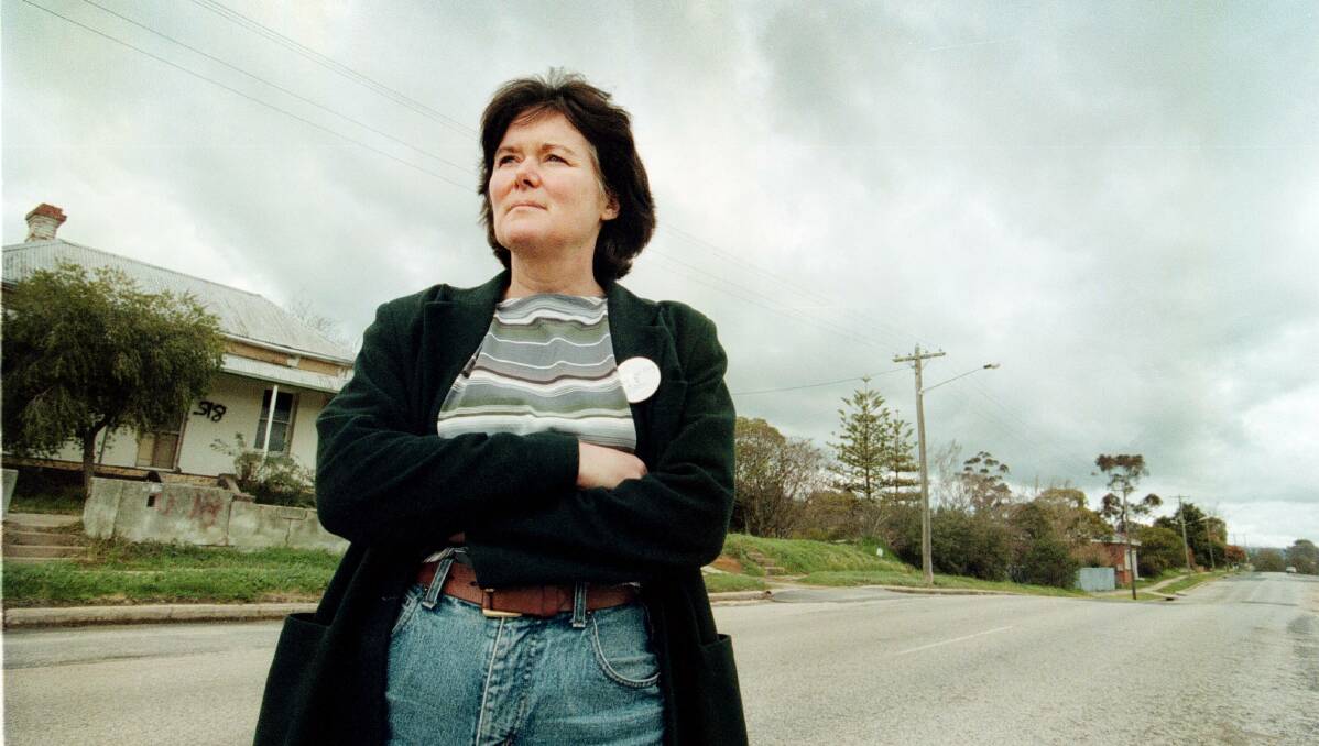 Lost world: Claire Douglas stands in East Albury's Parkinson Street in 1998. It disappeared when the freeway was constructed. 