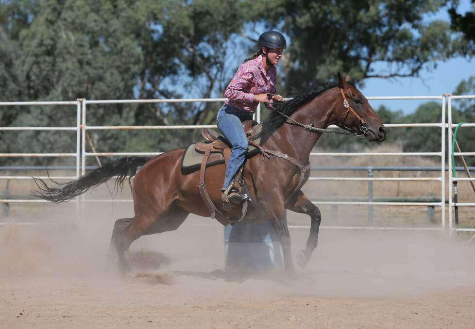 Living up to the name: Molly Phibbs, 17, stirs up the ground while riding Dusty. Picture: KYLIE ESLER