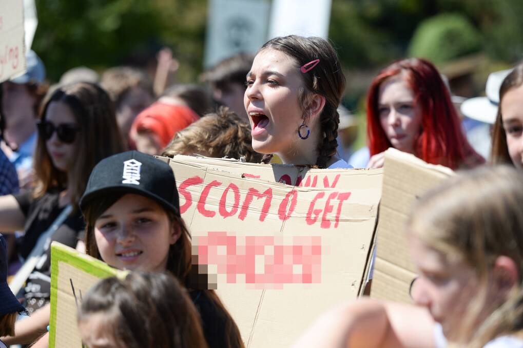 Direct message: Wangaratta High School student Nicola Paschke with her sign, which has been pixelated, aimed at Prime Minister Scott Morrison. Picture: MARK JESSER 