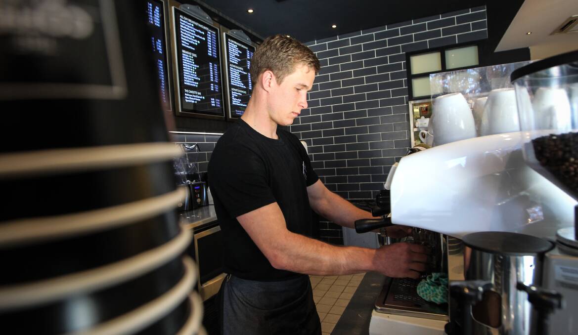 Flashback: Steamers rugby union player Sam Allen makes a brew at The Coffee Club in 2015.