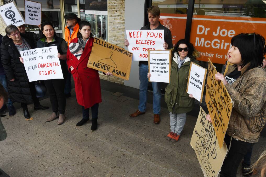 Upset: Pro-choice protesters irked by member for Wagga Joe McGirr's decision not to support the decriminalisation of abortion protest outside the MP's electorate office on Thursday. Picture: DAILY ADVERTISER