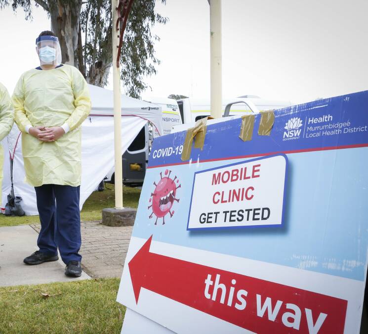 In protective gear: Corowa nurse Liam Minogue in his protective fear while COVID testing for the Murrumbidgee Local Health District. Picture: RIVERINE HERALD