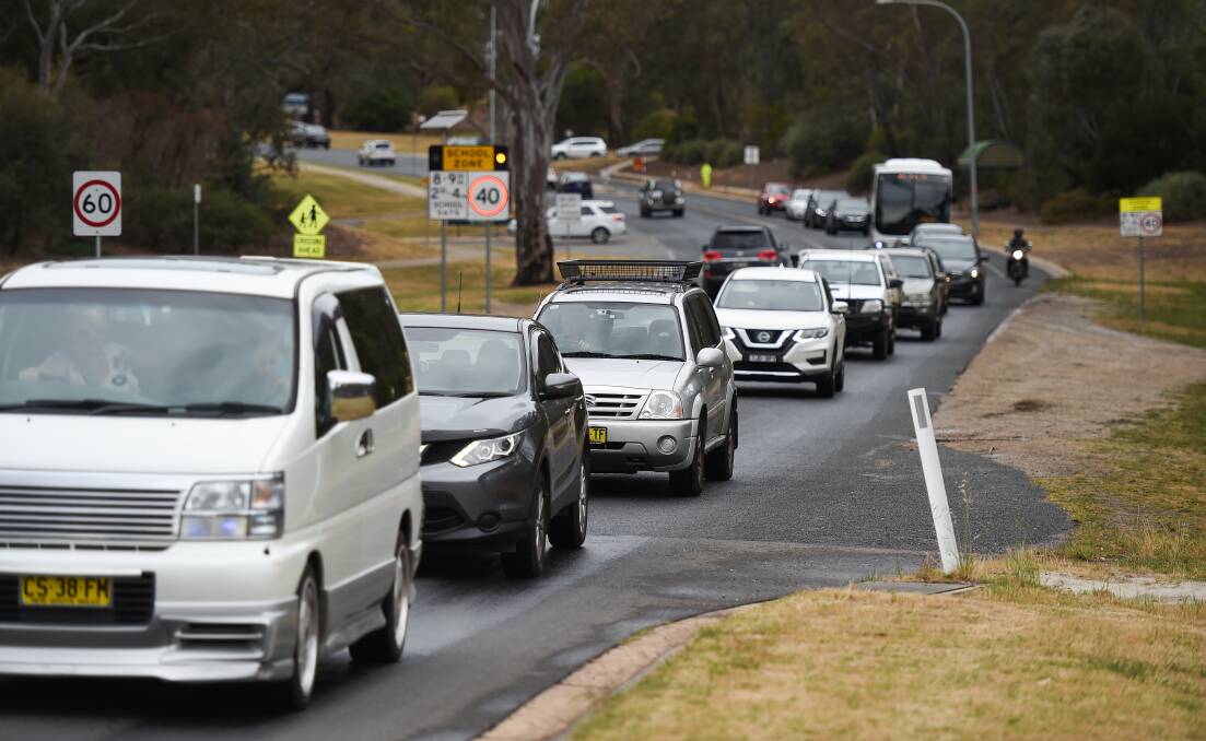 Traffic banks up on the eastern approach to the Thurgoona Drive-Elizabeth Mitchell Drive intersection. Picture by Mark Jesser
