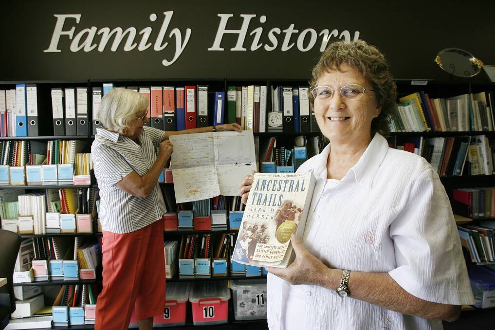 Flashback: Helen Cooksey (right) at the family history section of the Wodonga library in 2007. She is keenly awaiting information about where a temporary library for the city will be.