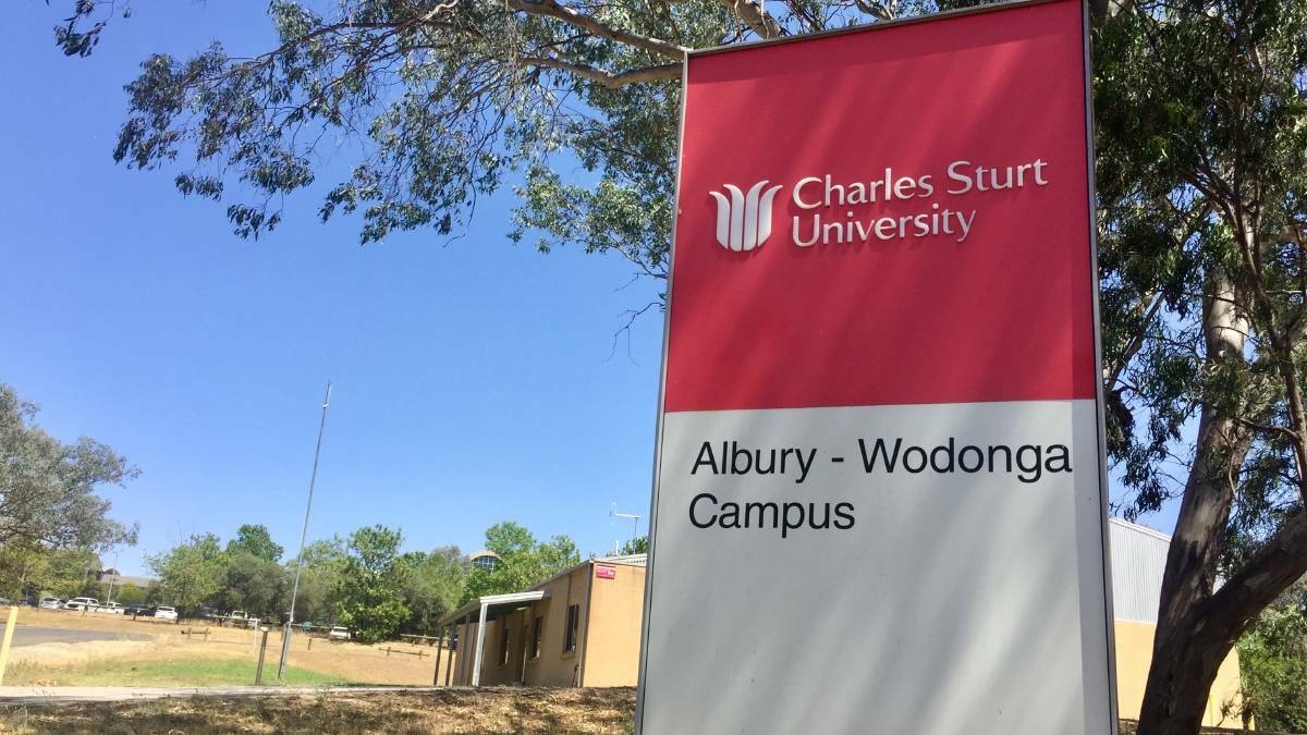 Sign stands: Charles Sturt University will retain its name, but its stylised desert pea logo faces an uncertain future.
