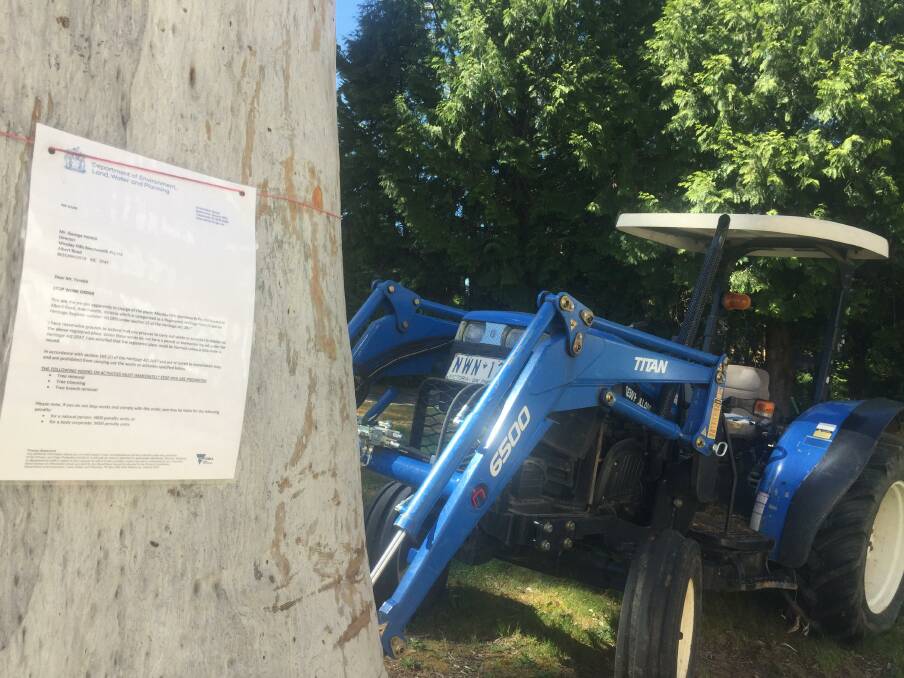 Hands off: One of the three Heritage Victoria stop-work letters strung around trees in the car park for the Linaker hotel. 