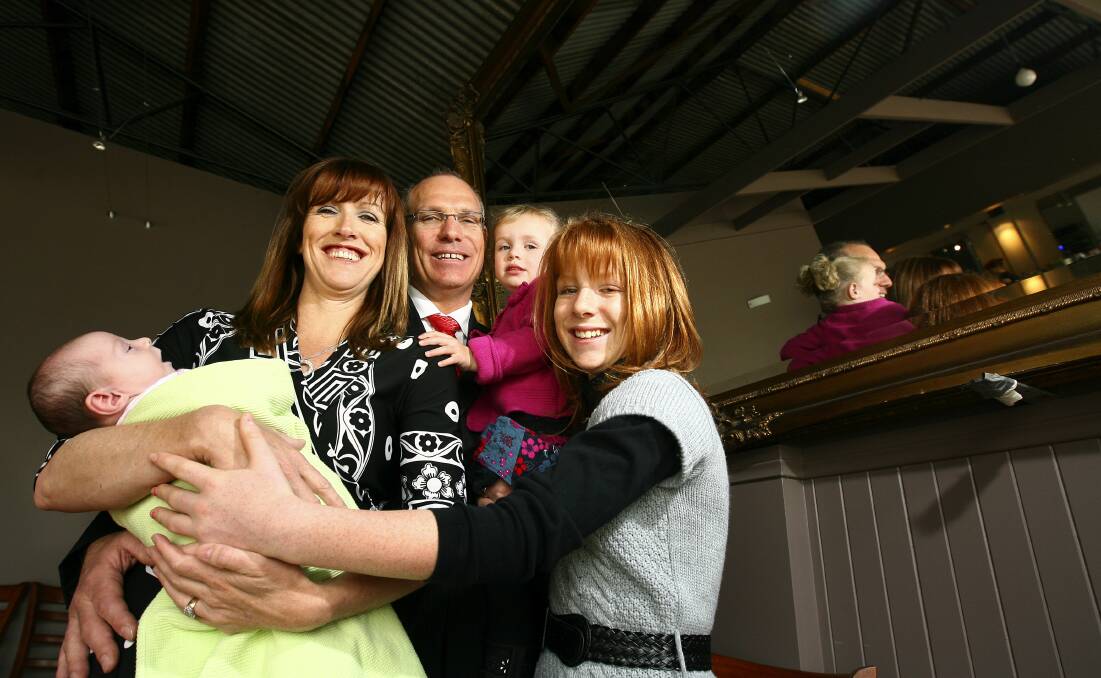 Proud of his family: Dean Woods in 2009 at the time of his political bid with wife Megan and daughters Devon, then three weeks, Kennedy, 2, and Paris, 12.