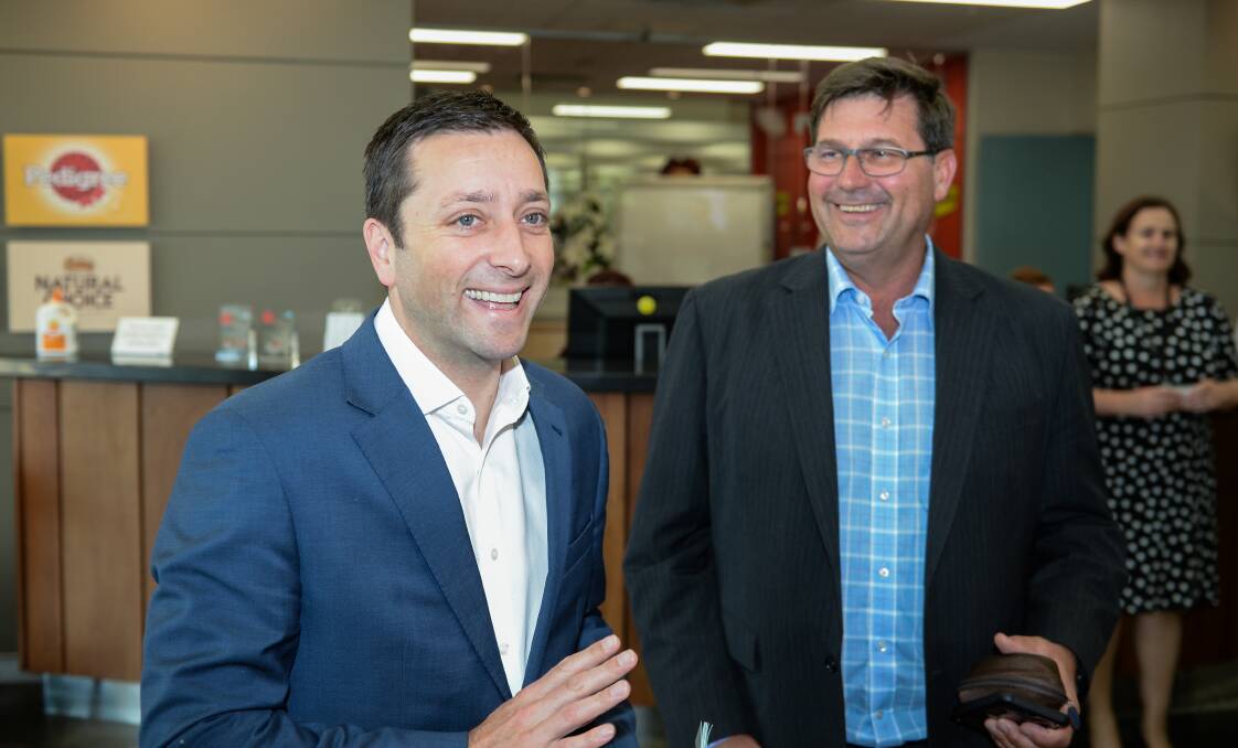 Happy days: Matthew Guy with Bill Tilley at Mars pet food factory in 2016. It was one of four visits the former planning minister made to Wodonga while Opposition Leader.