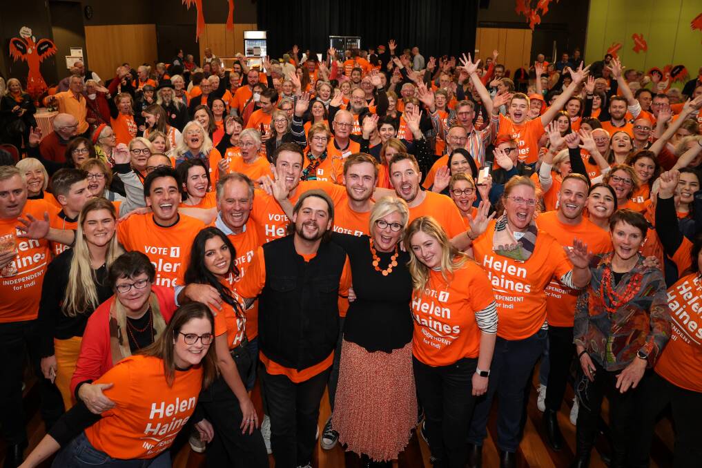 Sea of orange: Helen Haines and her family and supporters celebrate her retention of Indi in Saturday's federal election. Picture: JAMES WILTSHIRE