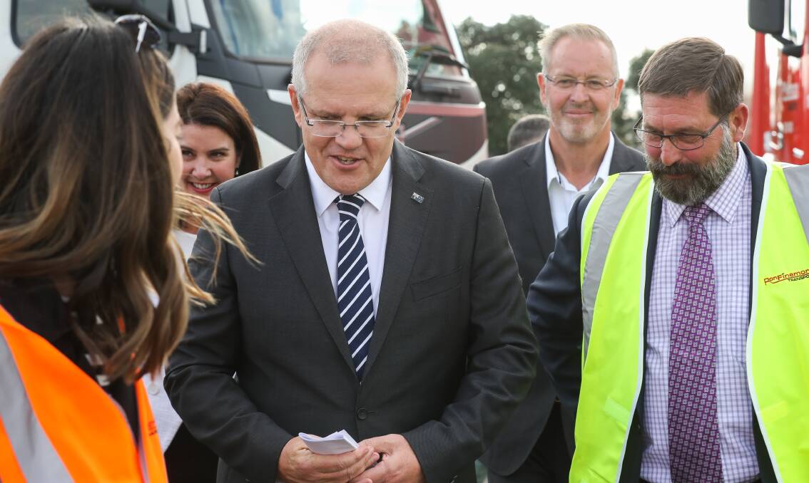 Offsider: Prime Minister Scott Morrison with Victorian Liberal MP Bill Tilley at the Ron Finemore Transport depot in Wodonga.