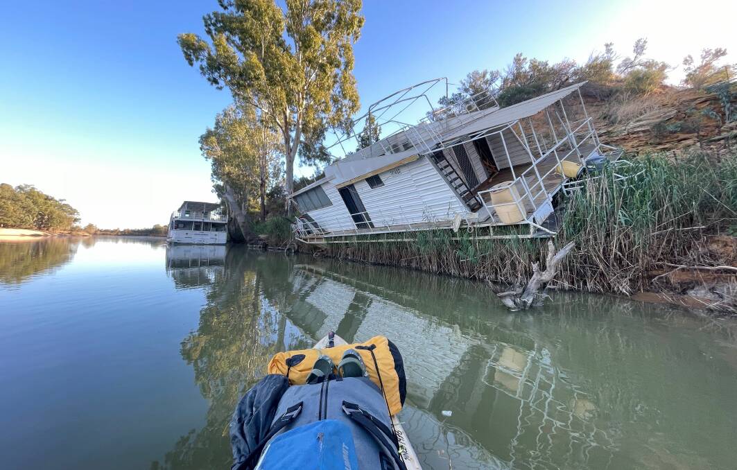 This houseboat shows the impact of floods along the Murray River last year is still evident.