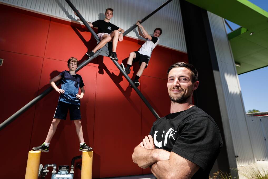 Scaling new heights: Parkour students Jack Sharp, Jorge Beaven and Tom Orchard and instructor Ben Lewis support a suggestion the Border should have a park for the pursuit. Picture: JAMES WILTSHIRE 