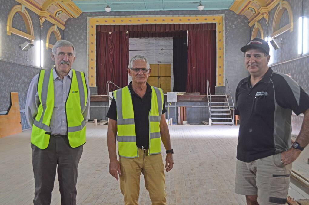 Happier times: Edward River mayor Norm Brennan, project manager John Webb and the contractor Frank Moretto inside the theatre area earlier this year. Picture: EDWARD RIVER COUNCIL