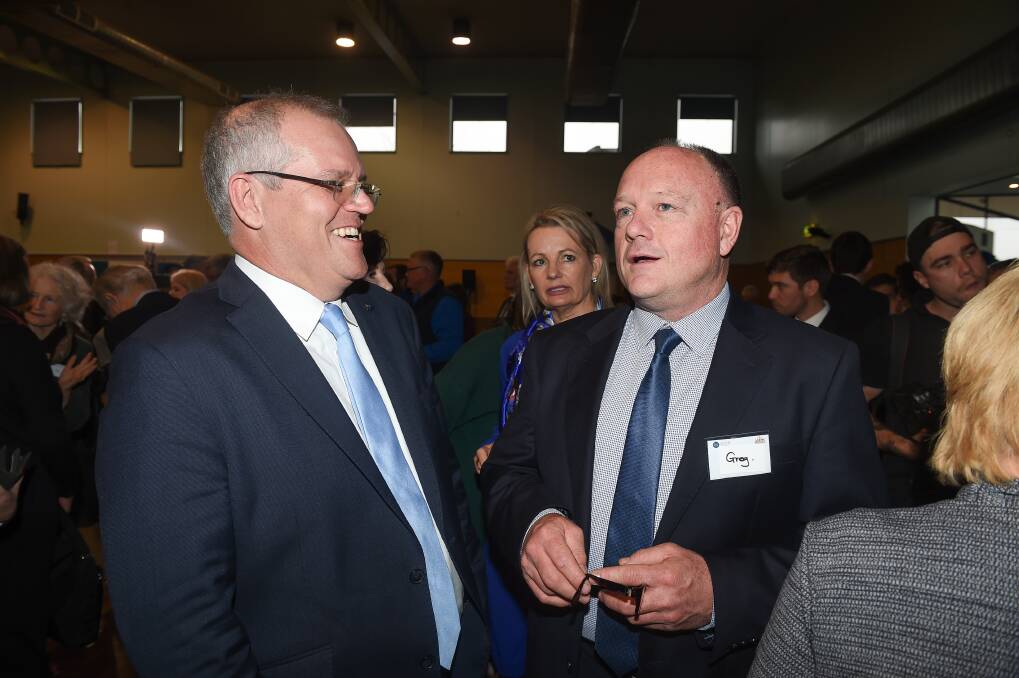 Liberal Party hierarchy: Prime Minister Scott Morrison with Greg Mirabella at Lavington's Mirambeena Community Centre in September. Mr Mirabella's wife Sophie unsuccessfully contested two elections against Indi MP Cathy McGowan.