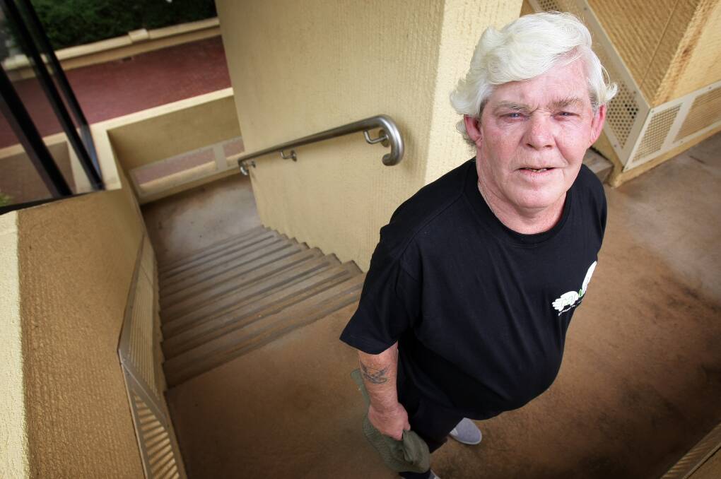 Flashback: Snowy, as he then preferred to be solely known as, poses for a Border Mail photo in a stairwell around Albury's QEII Square, where he used to sleep rough.