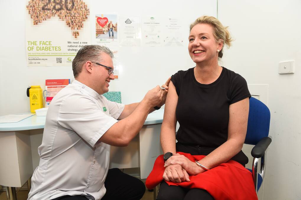 Shot in the arm: Nationals deputy leader Bridget McKenzie has an influenza vaccine shot in Wodonga in 2018 courtesy of pharmacist Josh Litchfield.