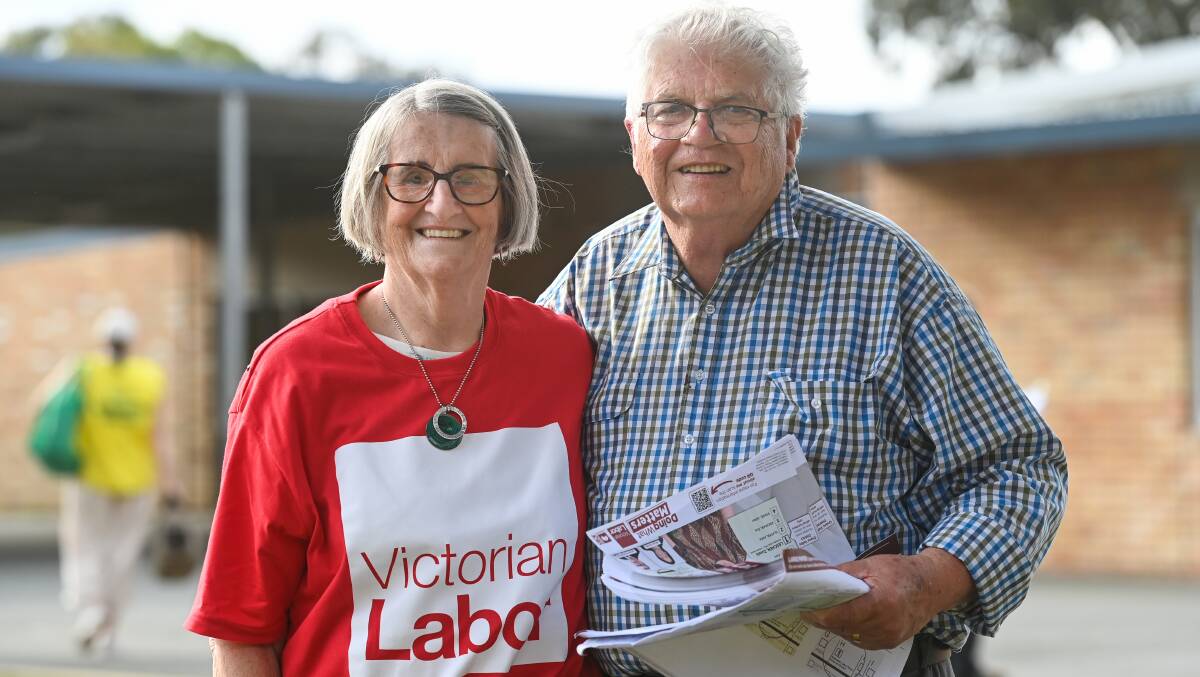 Retired couple Georgina and Erwell Rea handed out how-to-vote sheets at Wangaratta High School.