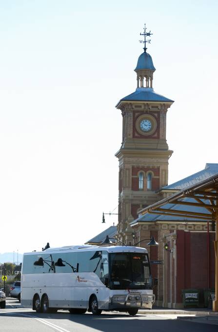 All aboard: The NSW TrainLink service, which is piloted by Dyson's bus drivers, leaves Albury train station on Tuesday.