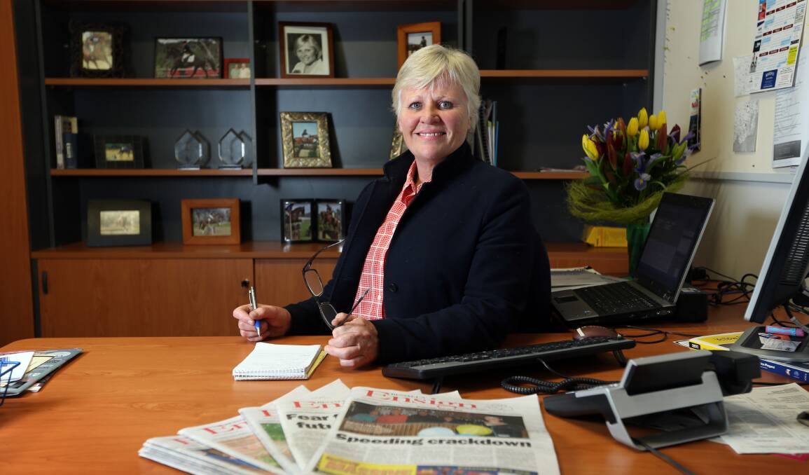 Radio return: Libby Price at the editor's desk of the Benalla Ensign at the time of her appointment in 2014.