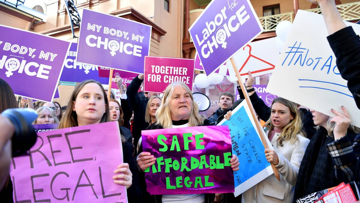 In favour: Pro-choice advocates protest outside Parliament House in Sydney on Tuesday.