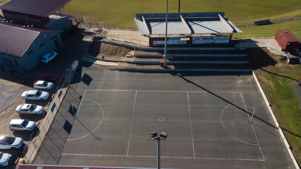 Unwanted lines: An aerial view of Martin Park's netball court showing fissures which have spread across all parts of the playing surface.