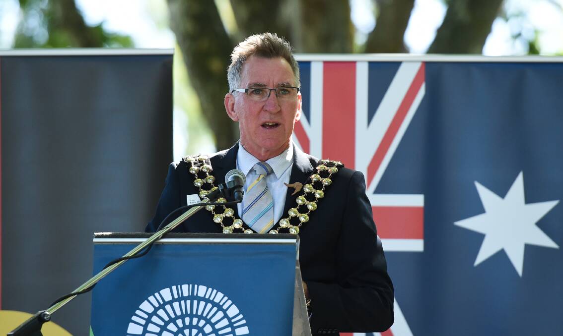 Debate hot point: Kevin Mack presides as mayor at Albury's Australia Day celebrations last year. His sharing of an Invasion Day meme has proven controversial.