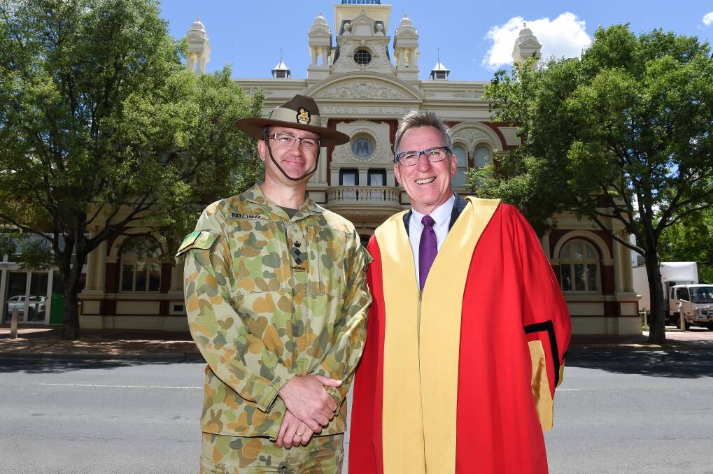 Reflecting: Army leader Matt Patching and Albury mayor Kevin Mack at the old town hall where a telegram on the armistice was read in 1918. Picture: MARK JESSER