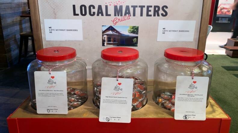 Voting place: An example of how Grill'd charity program Local Matters works with three containers taking bottle top deposits to support community groups. Picture: THE PULSE