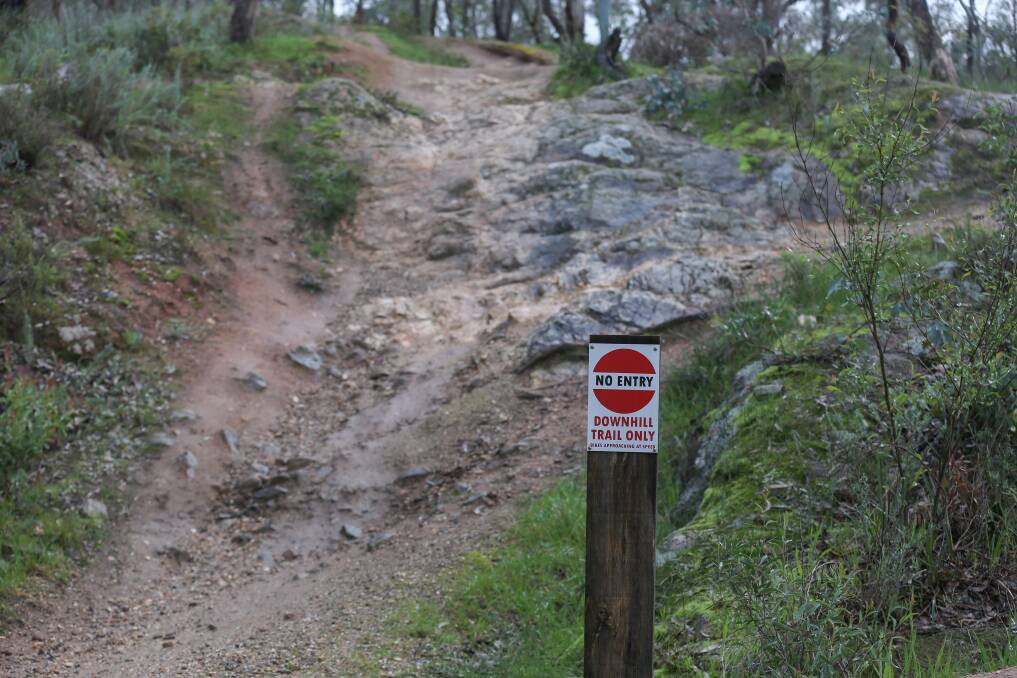 Marker: A sign on Nail Can Hill directing mountain bikers about where to ride. Picture: TARA TREWHELLA