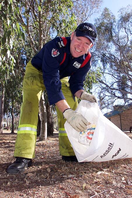 Community contributor: Phil Eberle assists with Clean Up Australia Day in Albury's Bonnie Doon Park in 2003.