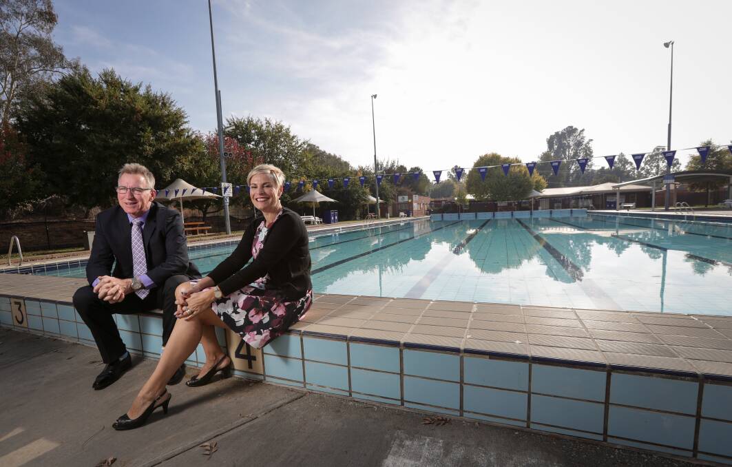 Open up: Mayors Kevin Mack (Albury) and Anna Speedie (Wodonga), pictured in April when they announced joint management of their council's pools, have been challenged to a radio debate by those upset at the aquatic centre contract.