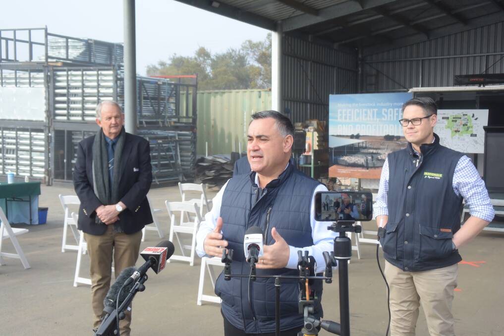 Fired up: NSW Deputy Premier John Barilaro responds to the media in Wagga on Tuesday, including a question from an ABC journalist that displeased him. Wagga mayor Greg Conkey and NSW Upper House Nationals member Wes Fang were standing behind him. Picture: DAILY ADVERTISER