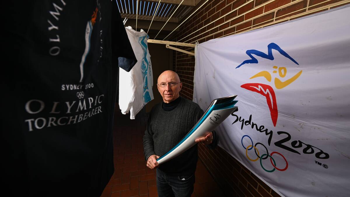 Sydney souvenirs: Graeme Hicks in his Wodonga backyard with memorabilia from his torch relay run and organisation. Picture: MARK JESSER