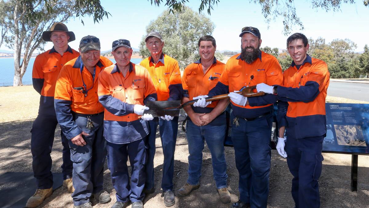 Direct link: Water NSW staff with the spade used by then Governor-General Sir Ronald Munro Ferguson to turn the first sod on the construction of the Hume Dam. Picture: TARA TREWHELLA